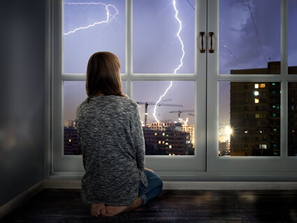 is it safe to sleep on the floor during lightning?