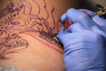 Why am I so tired after a tattoo?