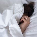 What does it mean if I sleep with dinosaur hands?